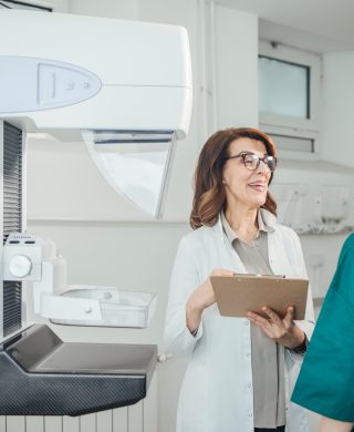 Woman,oncologist,talking,with,her,patient,on,mammography,examination.