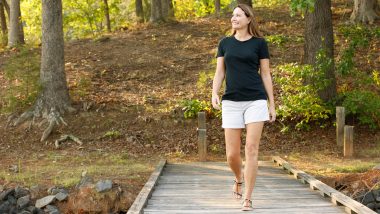 Woman walking on a dock, used to explain how to get rid of varicose veins