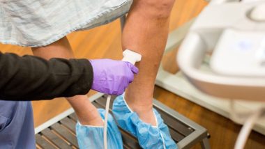 An image of a person that may have venous disease having a treatment administered to them by a vein specialist