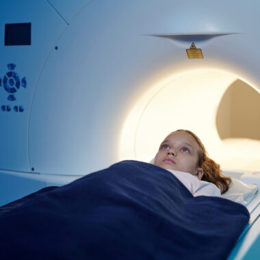 A child undergoing an MRI scan, used to explain pediatric radiology
